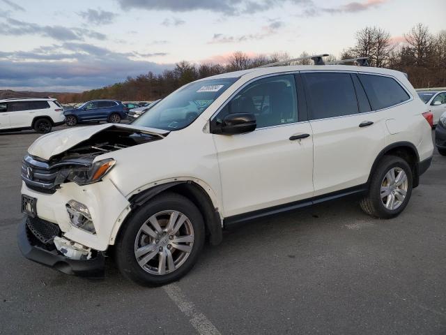 HONDA PILOT LX 2018 with VIN 5FNYF6H18JB051900 - Photo from auction