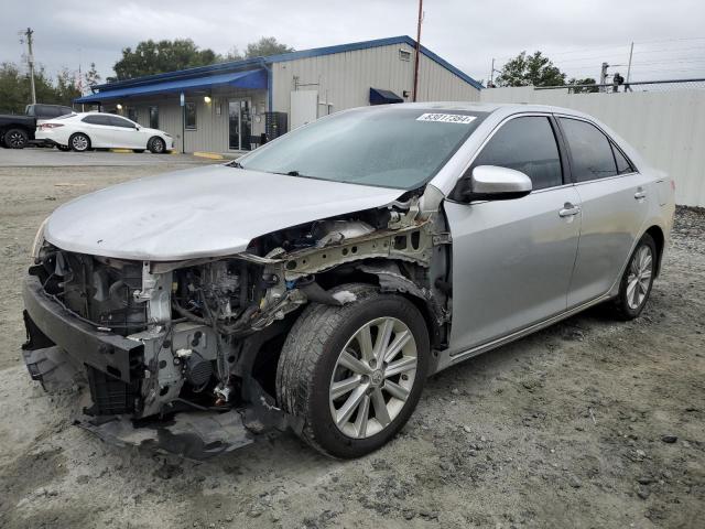 TOYOTA CAMRY HYBR 2012 with VIN 4T1BD1FKXCU011611 - Photo from auction