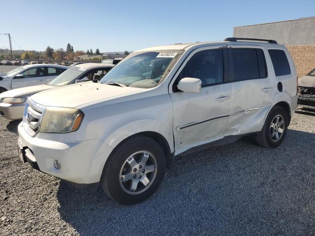 HONDA PILOT TOUR 2011 with VIN 5FNYF3H94BB014302 - Photo from auction