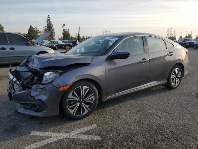 HONDA CIVIC EX 2017 with VIN 2HGFC1F35HH648189 - Photo from auction
