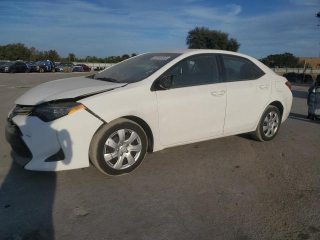 TOYOTA COROLLA L 2017 with VIN 5YFBURHE4HP670492 - Photo from auction