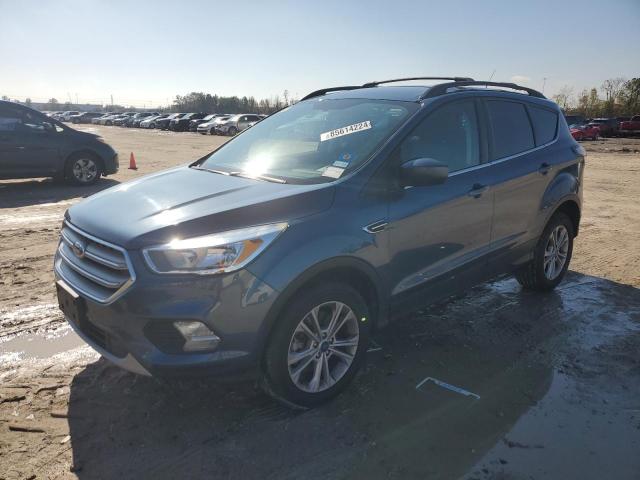 FORD ESCAPE SE 2018 with VIN 1FMCU9GD4JUC01551 - Photo from auction