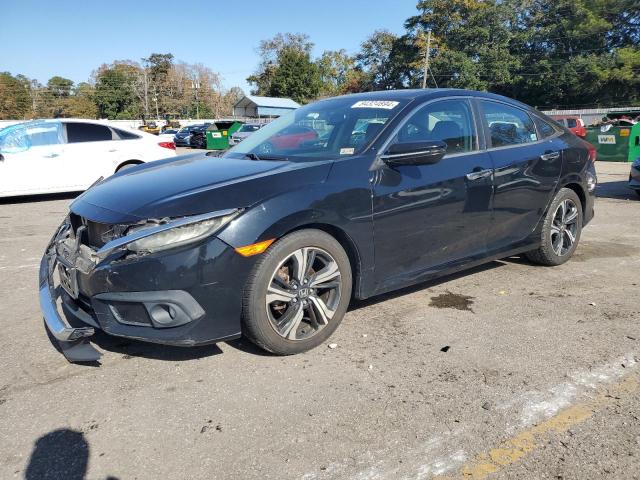 HONDA CIVIC TOUR 2016 with VIN 19XFC1F92GE032804 - Photo from auction