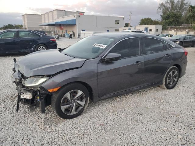 HONDA CIVIC LX 2019 with VIN 19XFC2F67KE010317 - Photo from auction