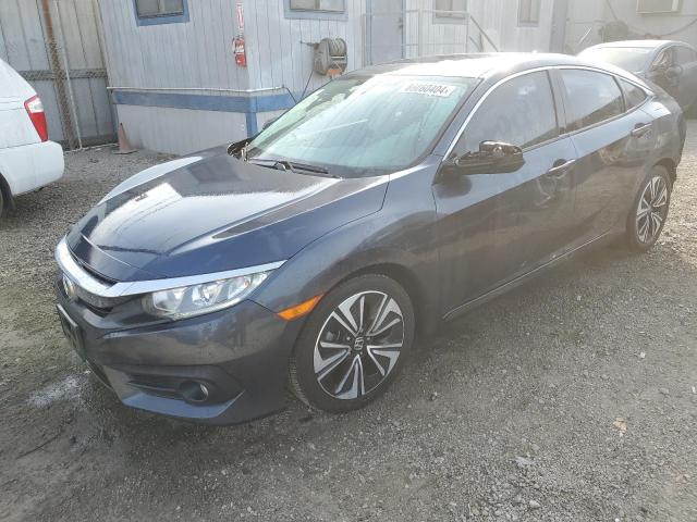 Photo 1 from auction – 2018 HONDA CIVIC EX with VIN JHMFC1F38JX038947