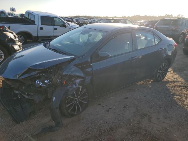 TOYOTA COROLLA L 2017 with VIN 5YFBURHE4HP586690 - Photo from auction