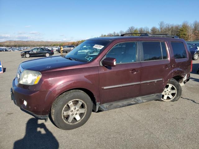 HONDA PILOT TOUR 2011 with VIN 5FNYF4H99BB065512 - Photo from auction