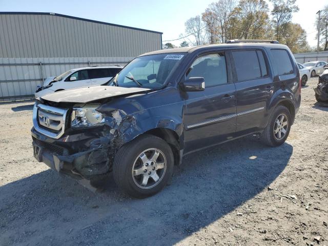 HONDA PILOT TOUR 2010 with VIN 5FNYF3H88AB011182 - Photo from auction