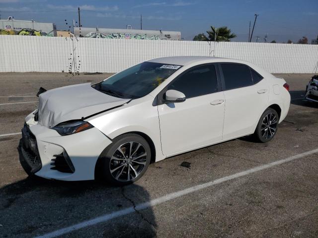 TOYOTA COROLLA L 2018 with VIN 5YFBURHE9JP828296 - Photo from auction