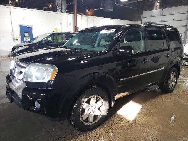 HONDA PILOT TOUR 2011 with VIN 5FNYF4H98BB003213 - Photo from auction