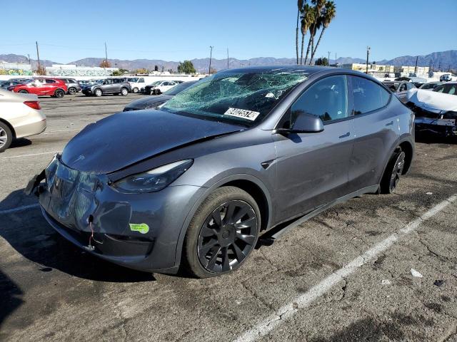 TESLA MODEL Y 2023 with VIN 7SAYGDEE1PF637410 - Photo from auction