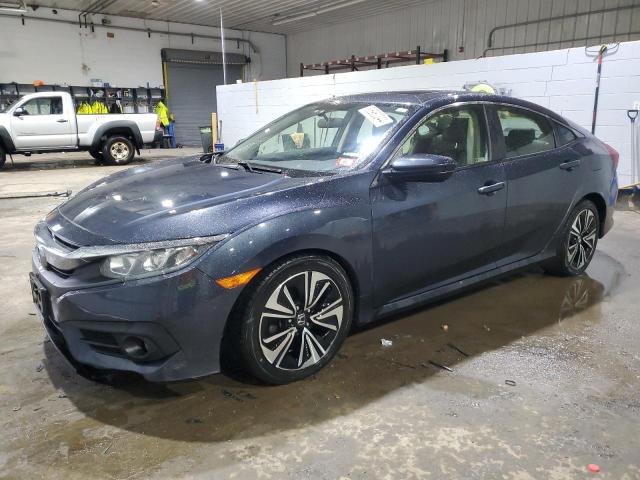 HONDA CIVIC EX 2018 with VIN JHMFC1F33JX036507 - Photo from auction