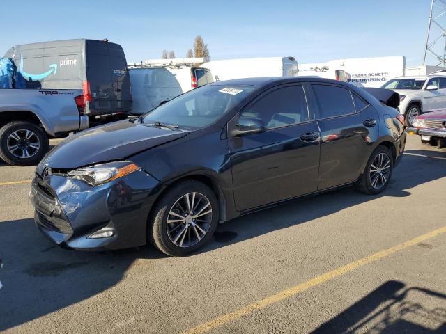 TOYOTA COROLLA L 2017 with VIN 5YFBURHE7HP642038 - Photo from auction