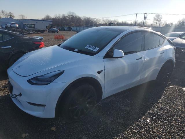 TESLA MODEL Y 2023 with VIN 7SAYGAEE1PF611713 - Photo from auction