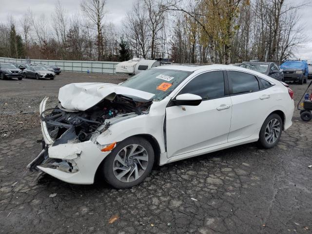HONDA CIVIC EX 2018 with VIN 2HGFC2F74JH570826 - Photo from auction