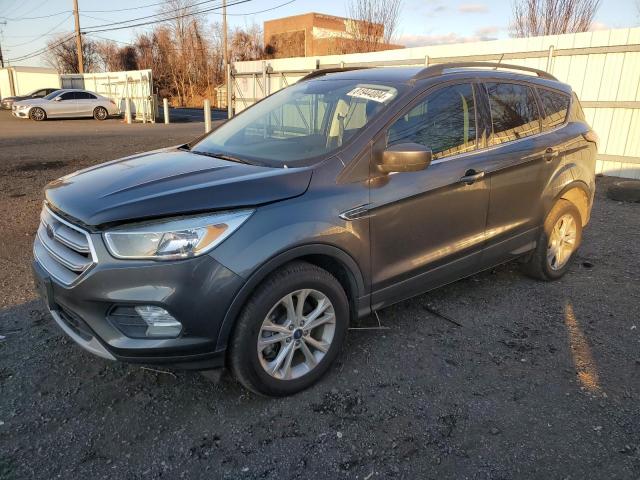 FORD ESCAPE SE 2018 with VIN 1FMCU9GD5JUA99256 - Photo from auction