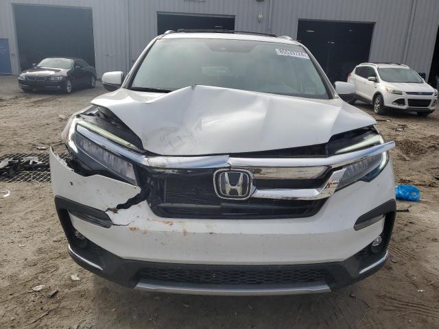 Photo 5 from auction – 2021 HONDA PILOT TOUR with VIN 5FNYF5H63MB017549