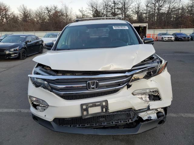 Photo 5 from auction – 2018 HONDA PILOT LX with VIN 5FNYF6H18JB051900
