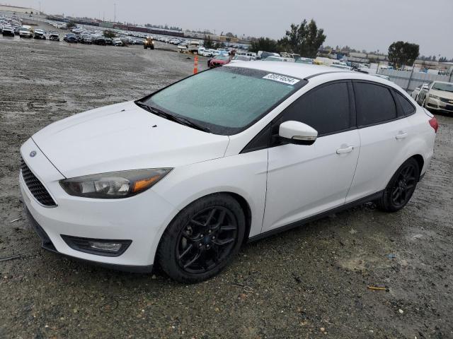 FORD FOCUS SE 2016 with VIN 1FADP3F20GL340173 - Photo from auction