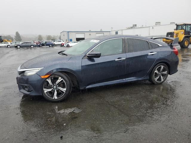 HONDA CIVIC TOUR 2017 with VIN 19XFC1F95HE211436 - Photo from auction