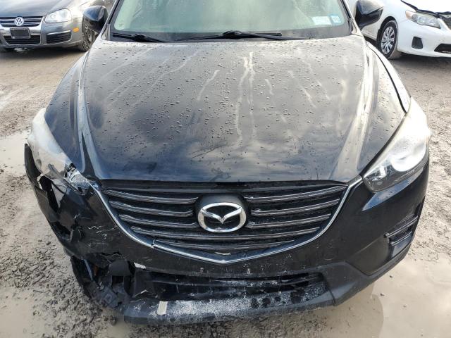 Photo 12 from auction – 2016 MAZDA CX-5 SPORT with VIN JM3KE2BY2G0896568