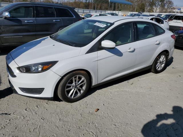 FORD FOCUS SE 2018 with VIN 1FADP3F28JL242063 - Photo from auction