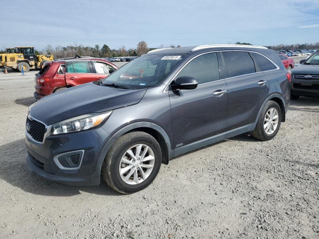 KIA SORENTO LX 2016 with VIN 5XYPGDA34GG166567 - Photo from auction