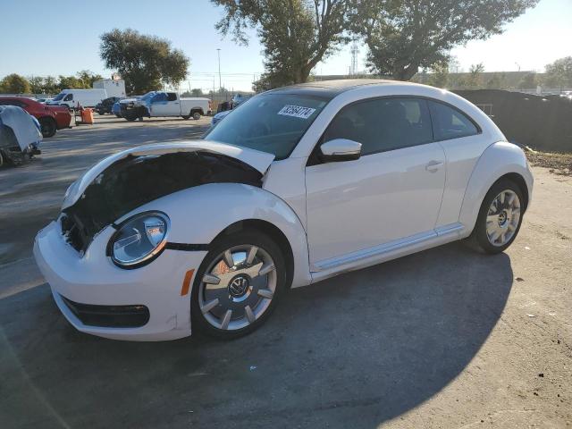VOLKSWAGEN BEETLE 2014 with VIN 3VWJ17AT7EM654840 - Photo from auction