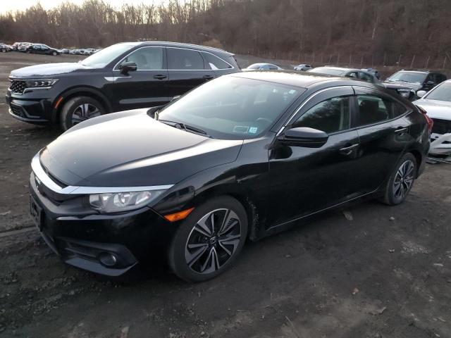 HONDA CIVIC EX 2018 with VIN 19XFC1F35JE201460 - Photo from auction