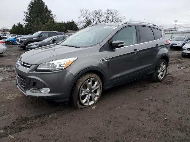FORD ESCAPE TIT 2014 with VIN 1FMCU0JX0EUA19785 - Photo from auction