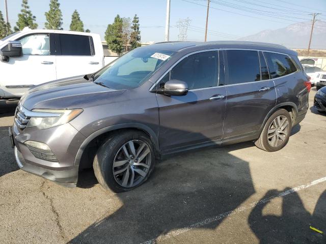 HONDA PILOT TOUR 2016 with VIN 5FNYF5H96GB016619 - Photo from auction