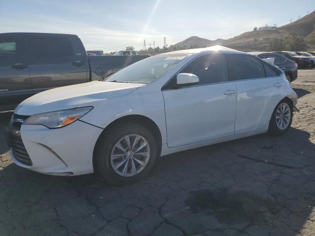 TOYOTA CAMRY LE 2017 with VIN 4T1BF1FKXHU698266 - Photo from auction