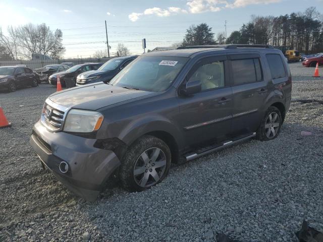 HONDA PILOT TOUR 2014 with VIN 5FNYF4H93EB014625 - Photo from auction