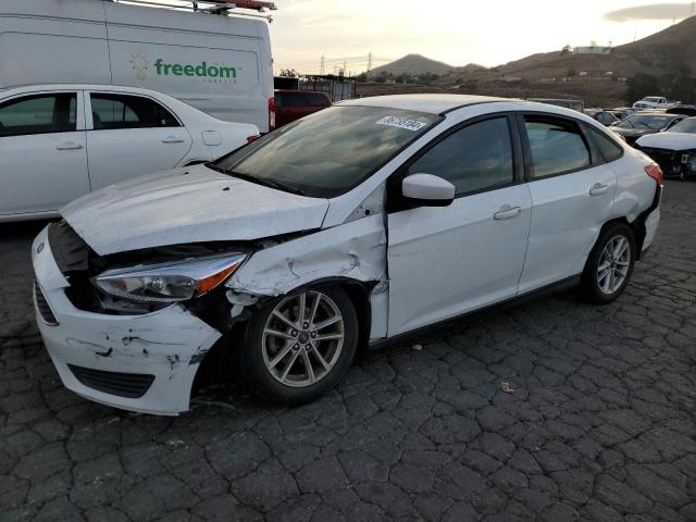 FORD FOCUS SE 2018 with VIN 1FADP3F20JL325079 - Photo from auction