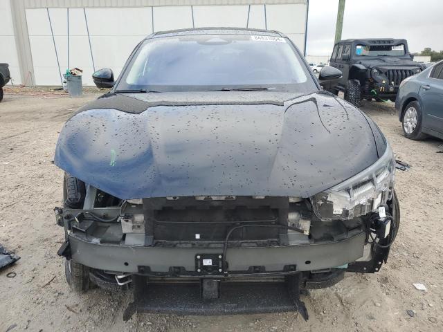 Photo 5 from auction – 2022 FORD MUSTANG MA with VIN 3FMTK3SS4NMA28150