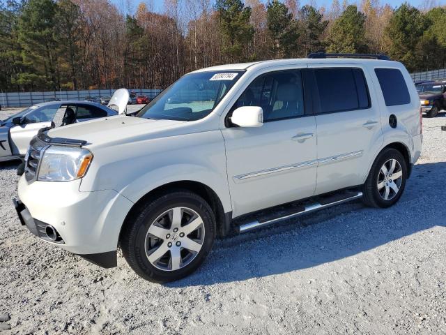 HONDA PILOT TOUR 2014 with VIN 5FNYF3H93EB023562 - Photo from auction