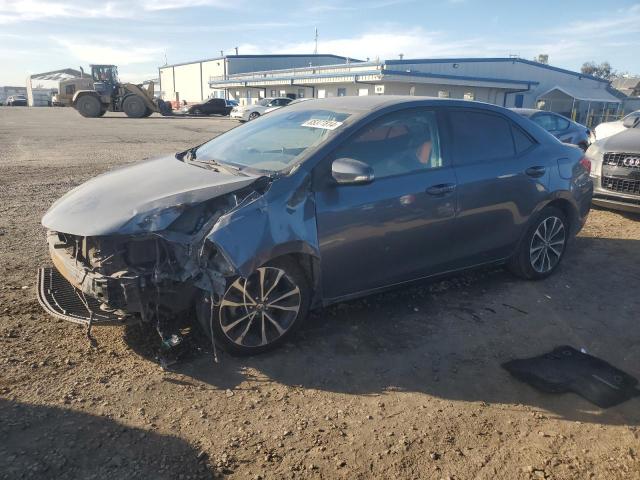 TOYOTA COROLLA L 2017 with VIN 5YFBURHE1HP673821 - Photo from auction