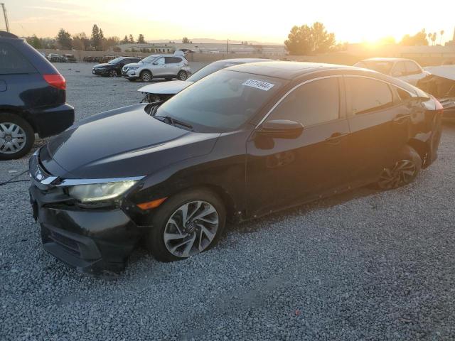 HONDA CIVIC EX 2016 with VIN 2HGFC2F71GH573613 - Photo from auction
