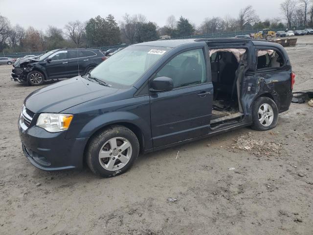 DODGE CARAVAN 2013 with VIN 2C4RDGCG9DR654617 - Photo from auction