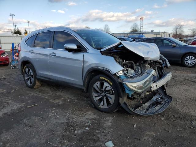Photo 4 from auction – 2015 HONDA CR-V TOURI with VIN 5J6RM4H94FL093404