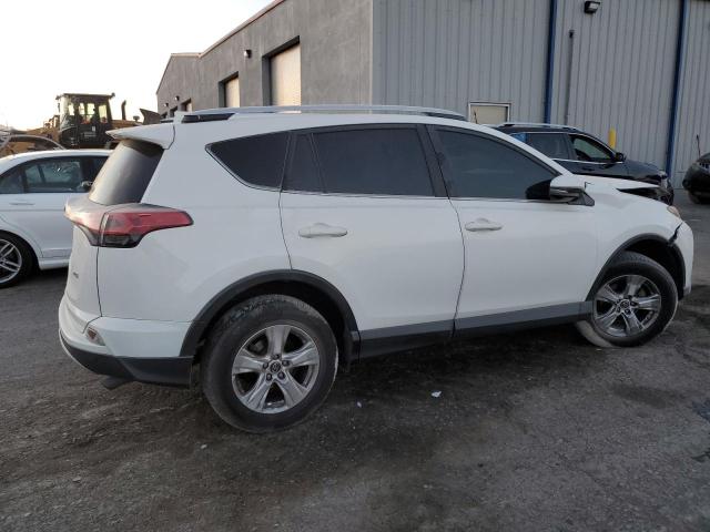 Photo 3 from auction – 2016 TOYOTA RAV4 XLE with VIN JTMWFREV9GJ092375