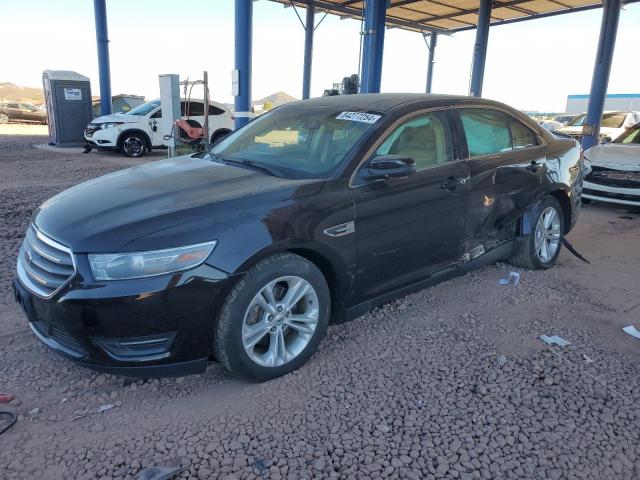 FORD TAURUS SEL 2014 with VIN 1FAHP2E8XEG137640 - Photo from auction