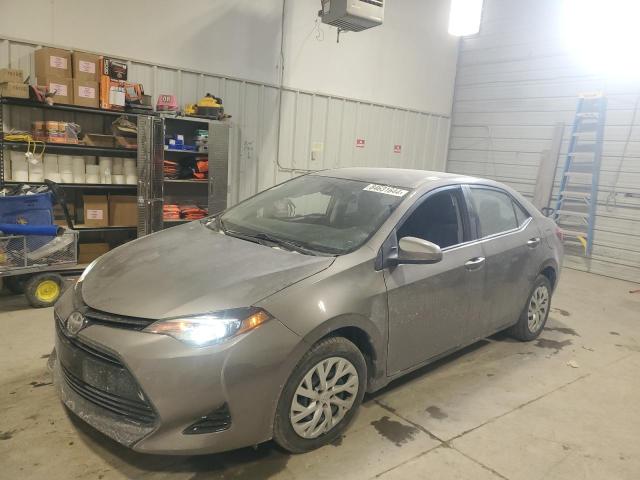 TOYOTA COROLLA L 2018 with VIN 5YFBURHE5JP779694 - Photo from auction