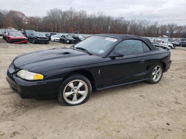 FORD MUSTANG CO 1997 with VIN 1FALP46VXVF163607 - Photo from auction