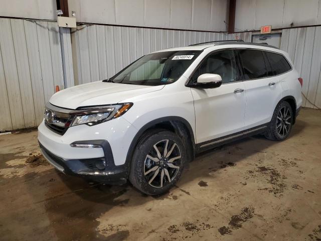 HONDA PILOT TOUR 2021 with VIN 5FNYF6H63MB073156 - Photo from auction