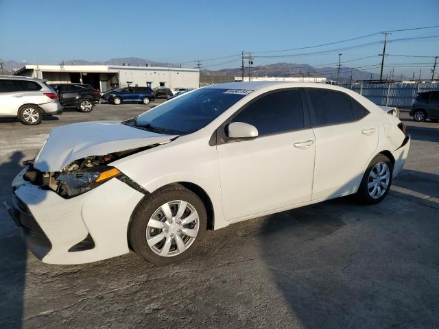 TOYOTA COROLLA L 2019 with VIN 5YFBURHE5KP871521 - Photo from auction