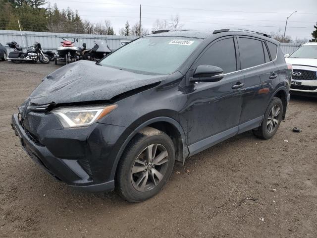 TOYOTA RAV4 LE 2018 with VIN 2T3BFREV0JW778568 - Photo from auction