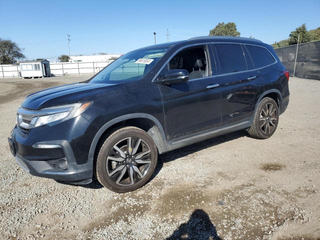 HONDA PILOT TOUR 2019 with VIN 5FNYF5H61KB043256 - Photo from auction
