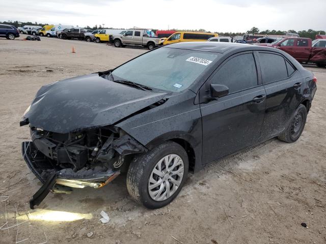 TOYOTA COROLLA L 2019 with VIN 5YFBURHE7KP869432 - Photo from auction