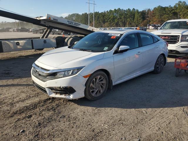 HONDA CIVIC EX 2018 with VIN 19XFC2F74JE036879 - Photo from auction